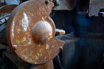 old rusty dirty machines and mechanisms in an abandoned factory