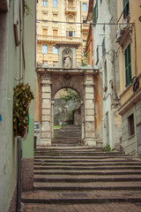 view of a narrow street in the historical center of the italian city genoa.