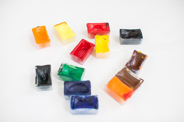 Bright stationery for drawing: paper, watercolor paints, brushes with a reservoir