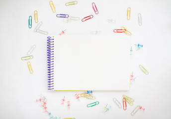 Bright stationery for study: paper, felt-tip pens, scissors, paper clips