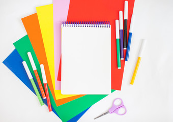 Bright stationery for study: paper, felt-tip pens, scissors