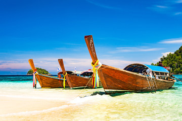 Fototapeta na wymiar Long tail boat on tropical beach, Andaman Sea Thailand