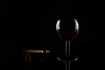 Fotobehang a glass of expensive cognac with a cigar © Vladimir