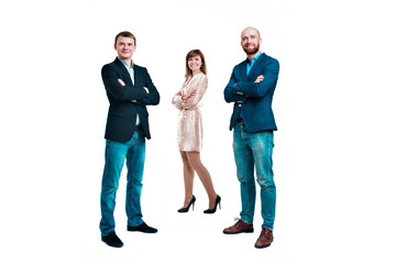 Obraz premium Business development concept: three people looking forward on a white background. Three attractive business people in suits stand next to each other all facing forward