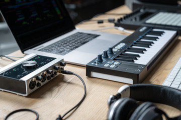 DJ tools for creating electronic music on a wooden table