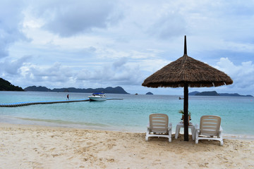 Chairs and Umbrella in Tropical Beach on Vacation. Image
