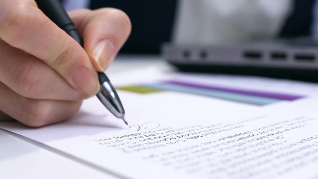 Female boss typing on laptop and signing report, approving project, authority