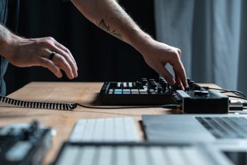 Dj man creates electronic music in the studio