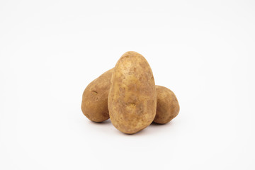 Fototapeta premium Three raw russet potatoes isolated on white background