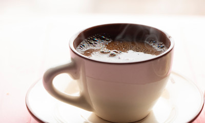 white coffee cup on wooden background. Aroma coffee