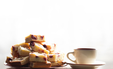 Home made cherry cake with vanilla and black cherries on window background 