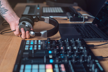 DJ Adult man creates electronic music in the studio