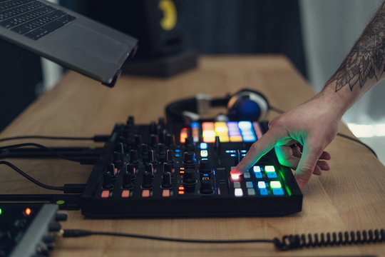 DJ Adult man creates electronic music in the studio