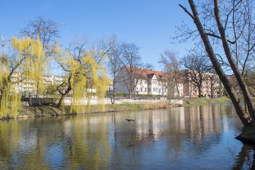 Obraz premium Spring embankment of the river Oder on a sunny day, Poland