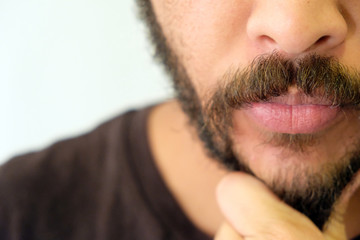 Mixed Race Man with beard close up portrait