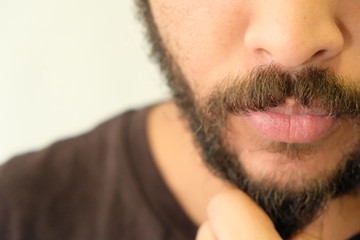 Obraz premium Mixed Race Man with beard close up portrait