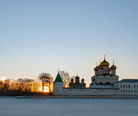 Fototapeta premium Old architecture of russian town. Beautiful church, domes, stone walls...