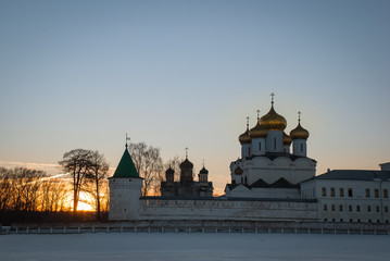 Fototapeta na wymiar Old architecture of russian town. Beautiful church, domes, stone walls...