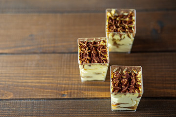 Dessert with mascarpone in cups. Concept for food, parties, desserts and cafes.