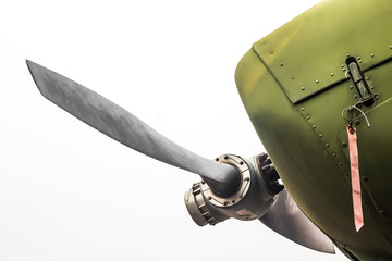Ancient green military aircraft propellers.