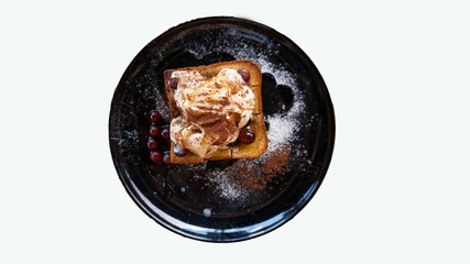 Ice cream bread in a black dish on a white background
