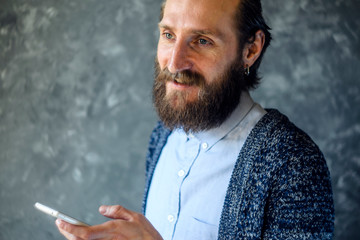 Bearded Man Have Business Meeting Via Video Call Against Gray Wall in a Office