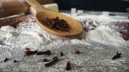 spices in spoons on wooden spoon