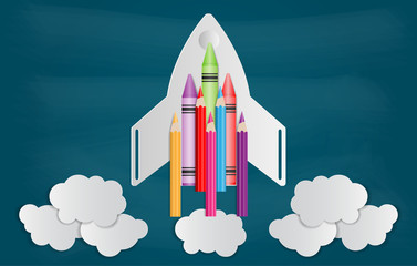 Obraz premium Crayon with paper cut of rocket and cloud on chalkboard. Back to school