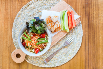 Thai food Papaya salad chicken served vegetables