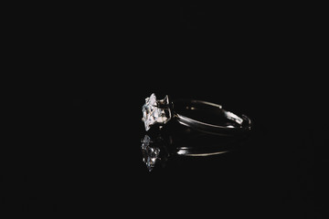 engagement ring with pure diamond isolated on black