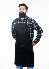 His beard deserves to show it off. Hipster with bearded face. Bearded barber or cook. Bearded man wearing barber or cooking apron. Long bearded man keeping arms crossed