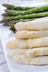 New harvest of white and green asparagus vegetable in spring season, washed asparagus ready to cook, spring menu for restaurants