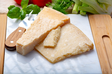 Original italian cheese, aged Parmesan cow milk cheese, pieces of Parmigiano-Reggiano