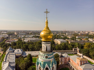 Fototapeta na wymiar Cross on the golden dome of the church