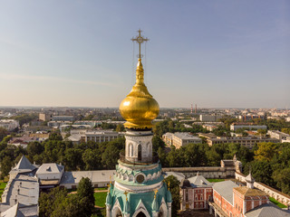 Cross on the golden dome of the church
