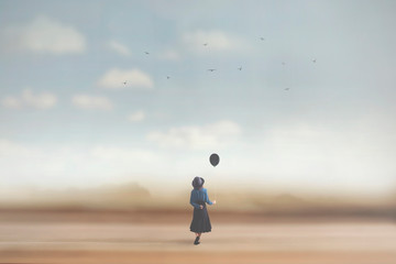 surreal image of a young woman dreaming with a balloon in her hand