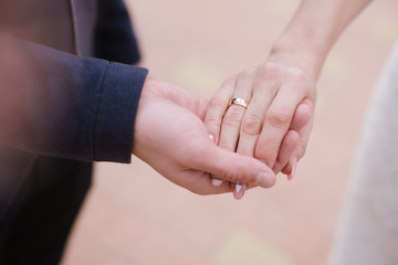 Close up photo of Holding Hands Married couples holding hands. wedding theme