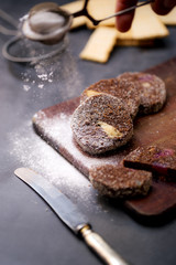 Chocolate salad with biscuits on a wooden board