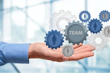 Businessman and analytics symbols on grey background