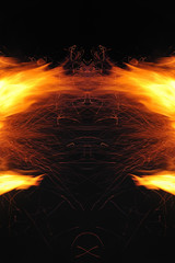 Abstraction, burning fire with sparks. Mystical prototype with patterns for the background. Horizontal reflection.