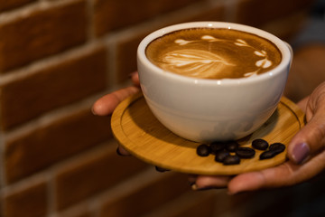 Backgrounds of Latte coffee, Coffee cup latte art in shop.
