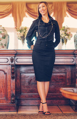 Elegant African-American woman in a stylish black dress