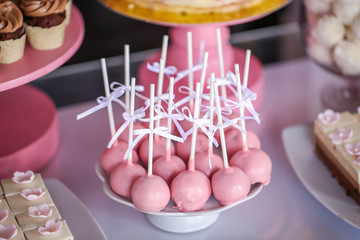 Pink cake pops  in a candy bar, selective focus