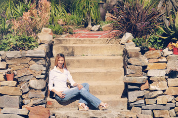 African-American lady in jeans in the garden