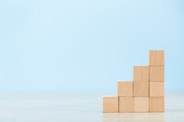 Stacking wooden blocks into steps,Concept of business growth success