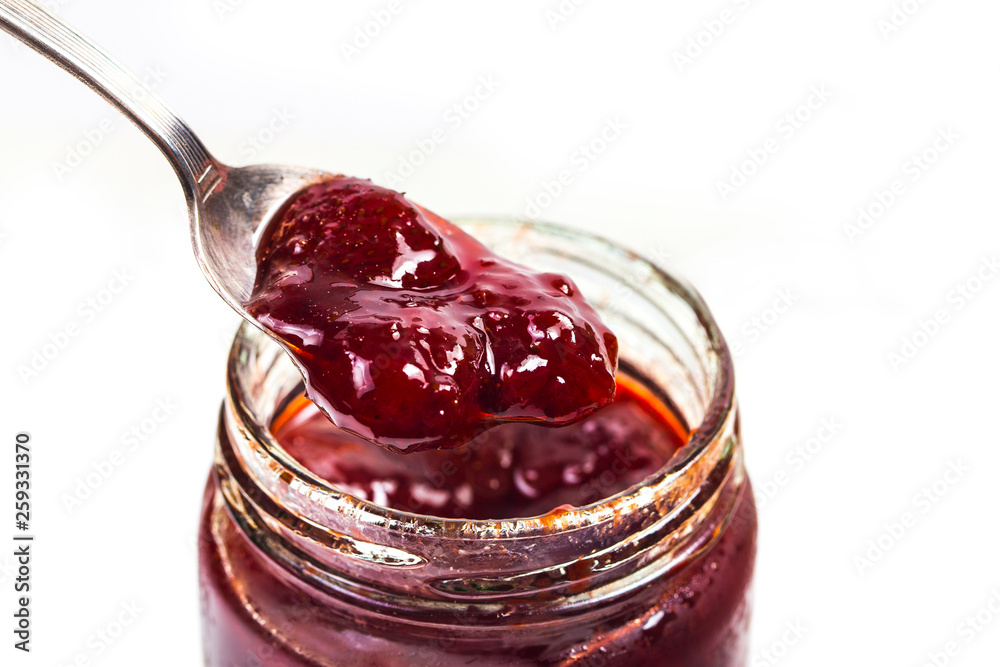 Poster Jar of strawberry jam on  wooden background from top view