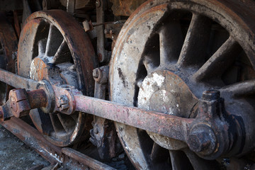 rusty wheels of old steam locomotive