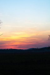 sky and clouds over hills at sunset