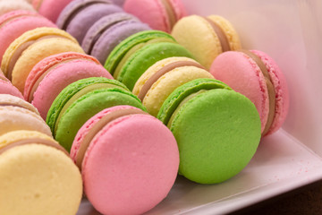 colorful macaroons on white background