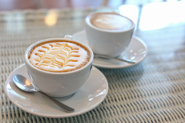 hot caramel macchiato coffee drink put on table in cafe